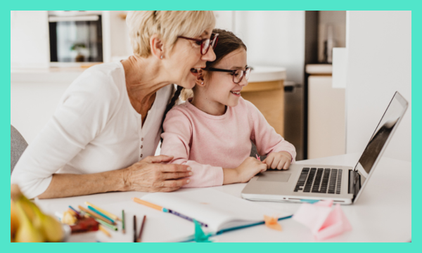 Woman and child using laptop