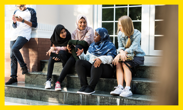 Young people on step chatting