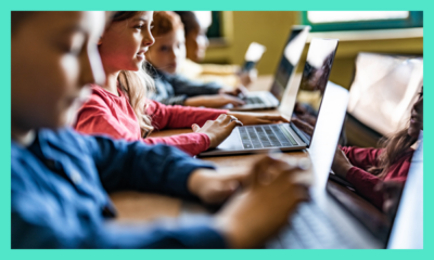 Group of young people on laptops