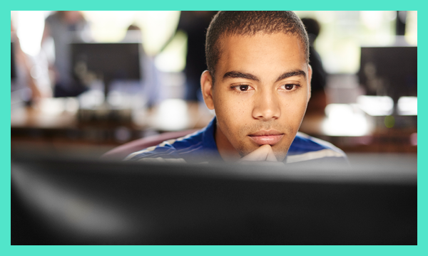 Young person looking at desktop screen